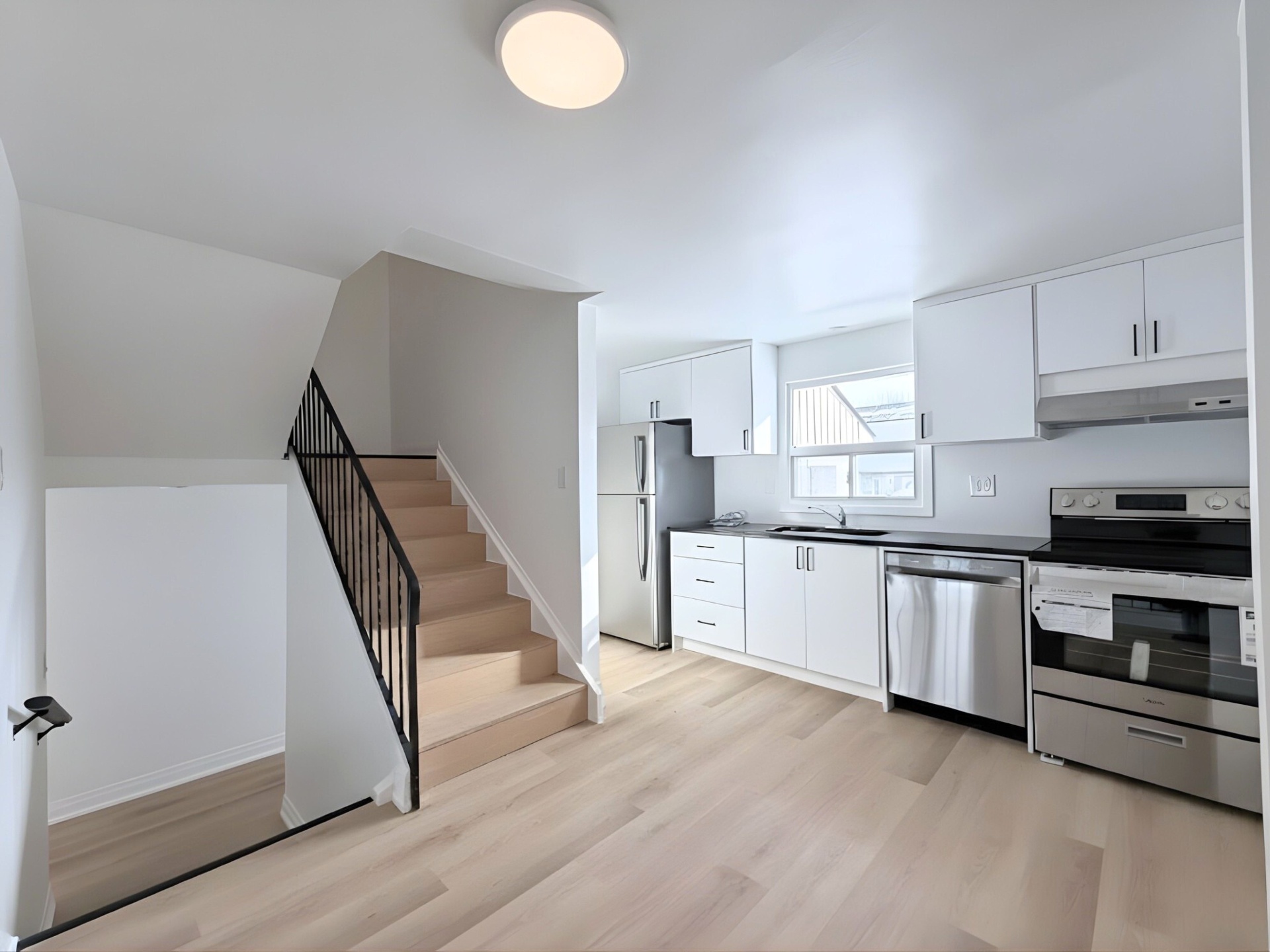 Kitchen and stairwell with modern finishes