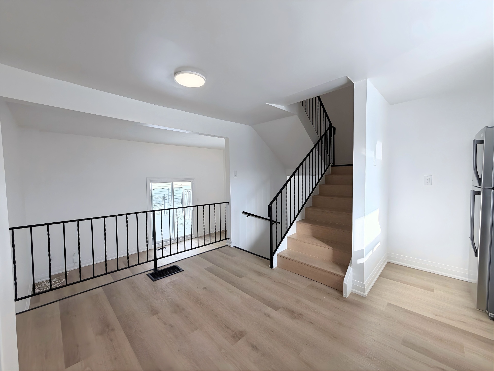 Upper-level landing with hardwood floors